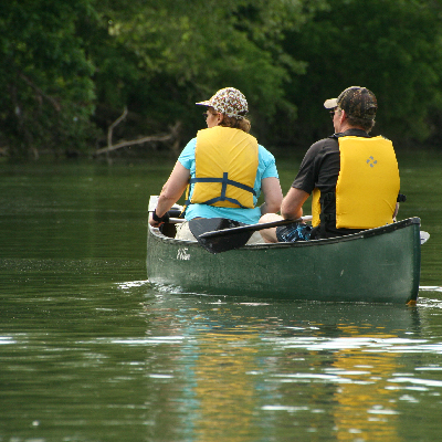 two people canoeing